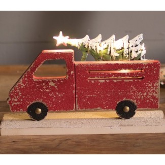  Camión rojo que lleva el árbol de Navidad 